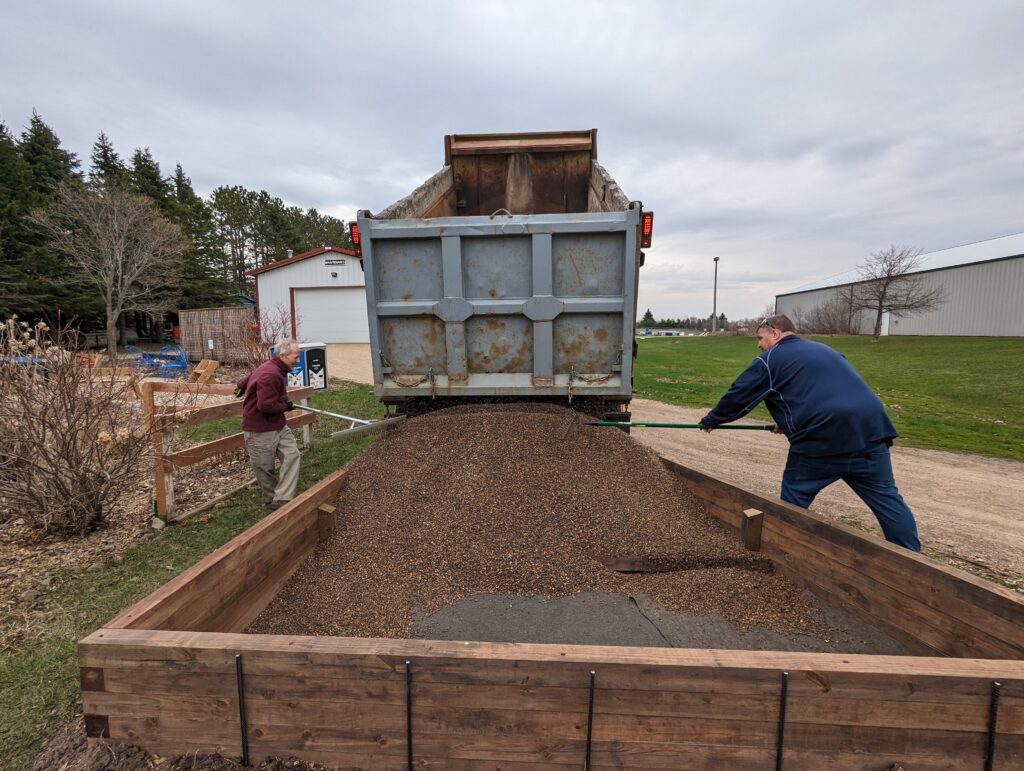 Gravel delivery day! Several cubic yards of gravel filled the bed.